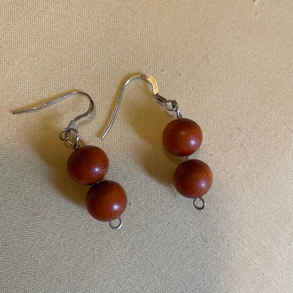 Wood stacked spheres on french wires